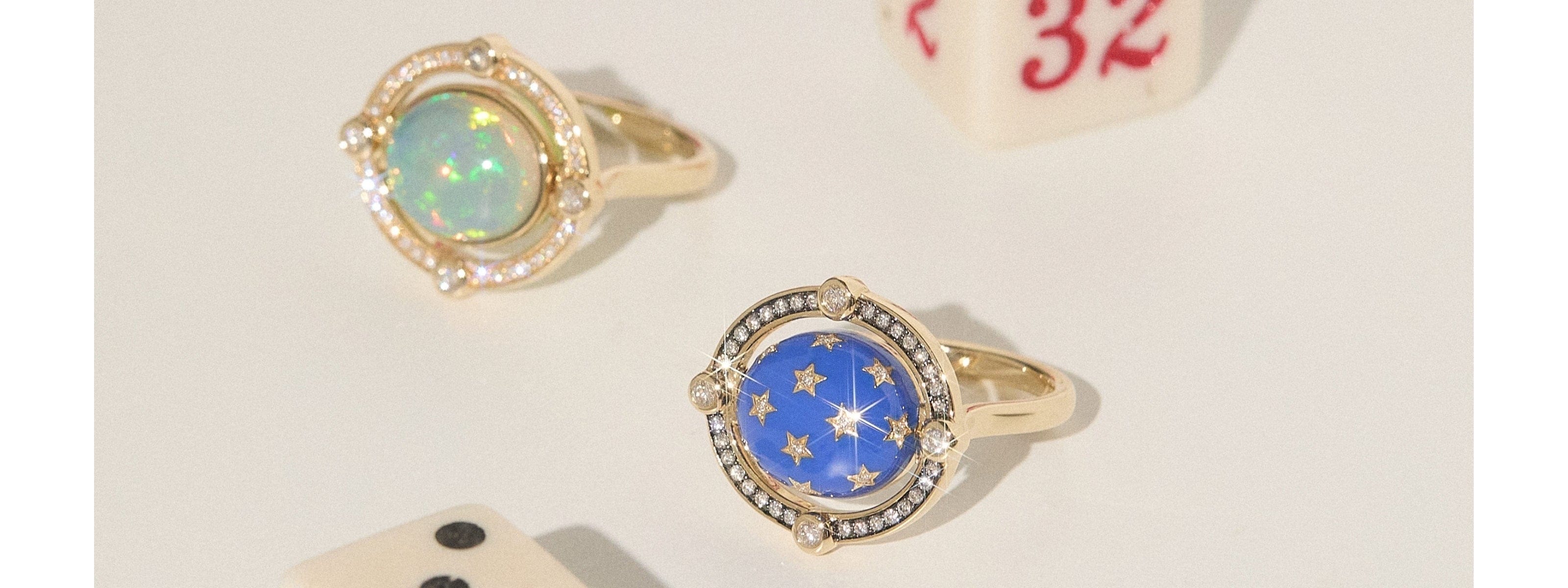 gold and enamel rings with diamond stars